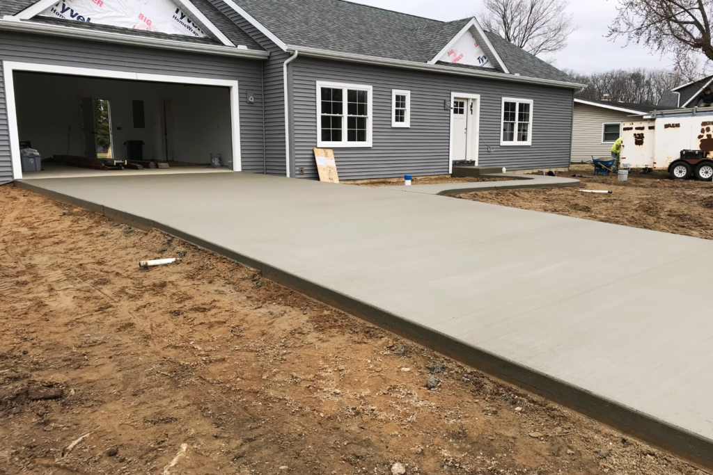 Navy blue residential home concrete slab driveway